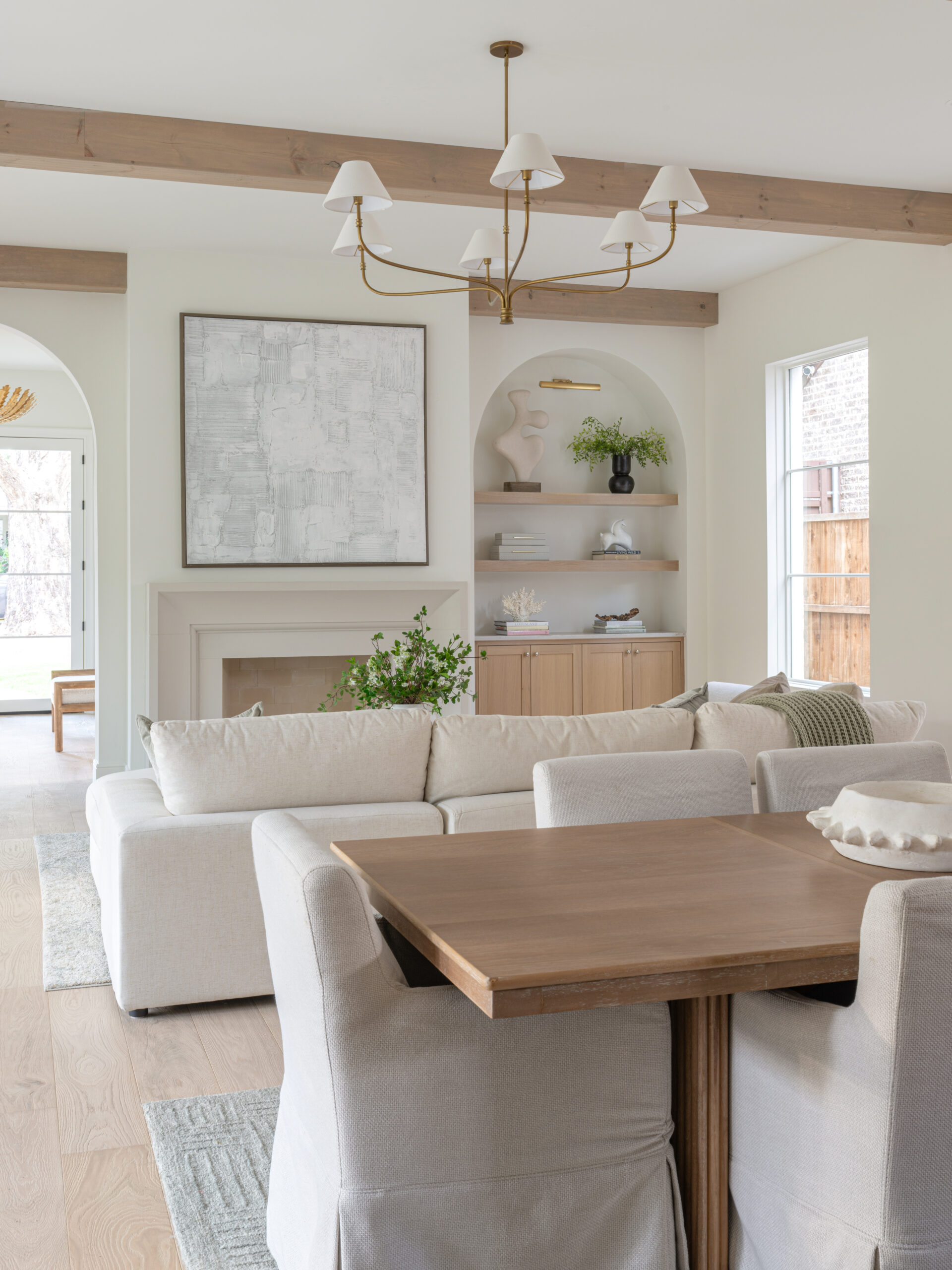 CLASSIC EUROPEAN REVIVAL – Chamberlain Arlington Heights, Lafayette Ave, Fort Worth, TX 76107-13 Living and dining room with wood beams, plaster fireplace, and arched built-ins — custom remodel, Fort Worth TX
