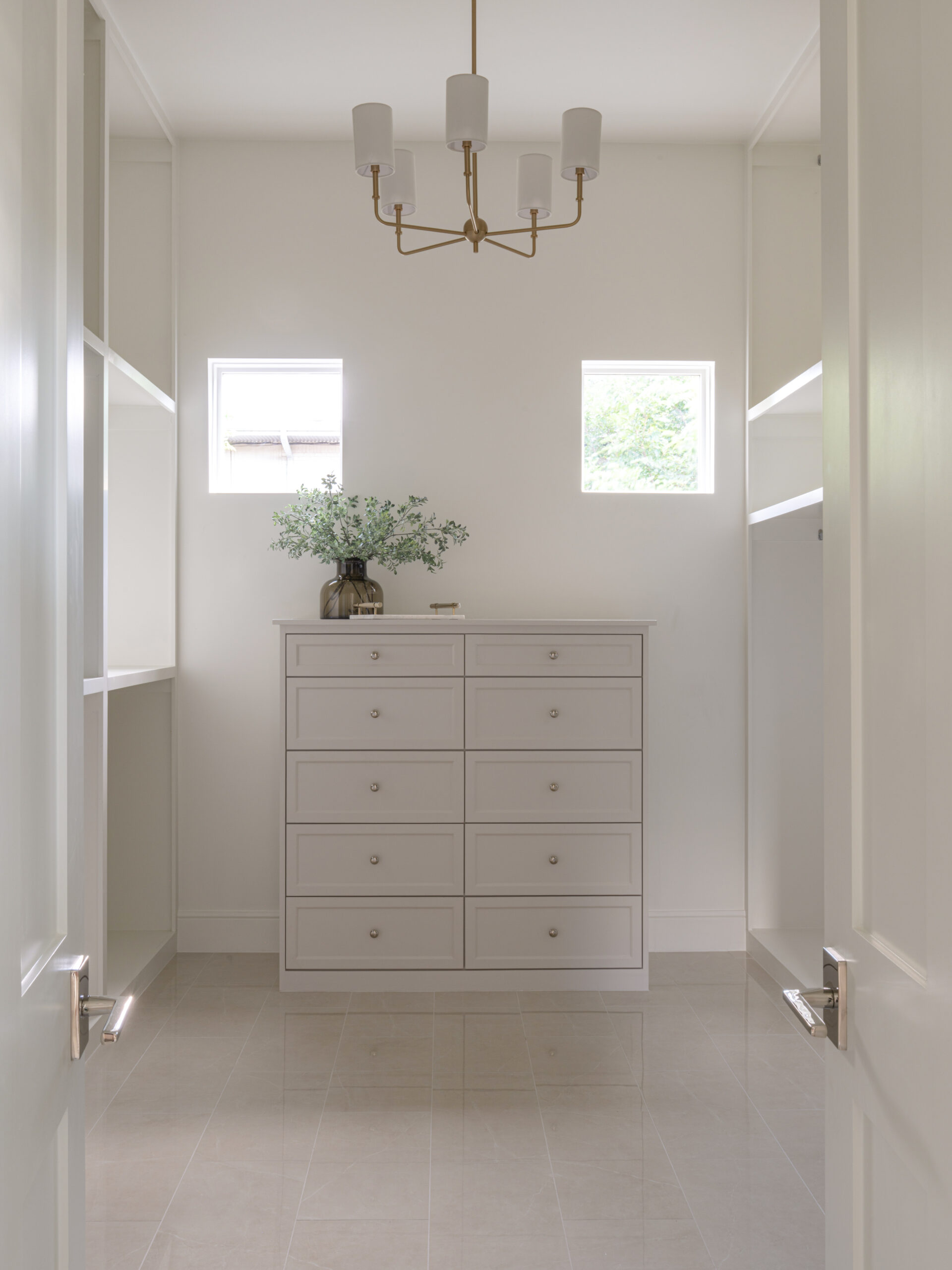 CLASSIC EUROPEAN REVIVAL – Chamberlain Arlington Heights, Lafayette Ave, Fort Worth, TX 76107-23 Walk-in closet with built-in dresser and brass chandelier — Blue Cypress Design Build, Fort Worth TX