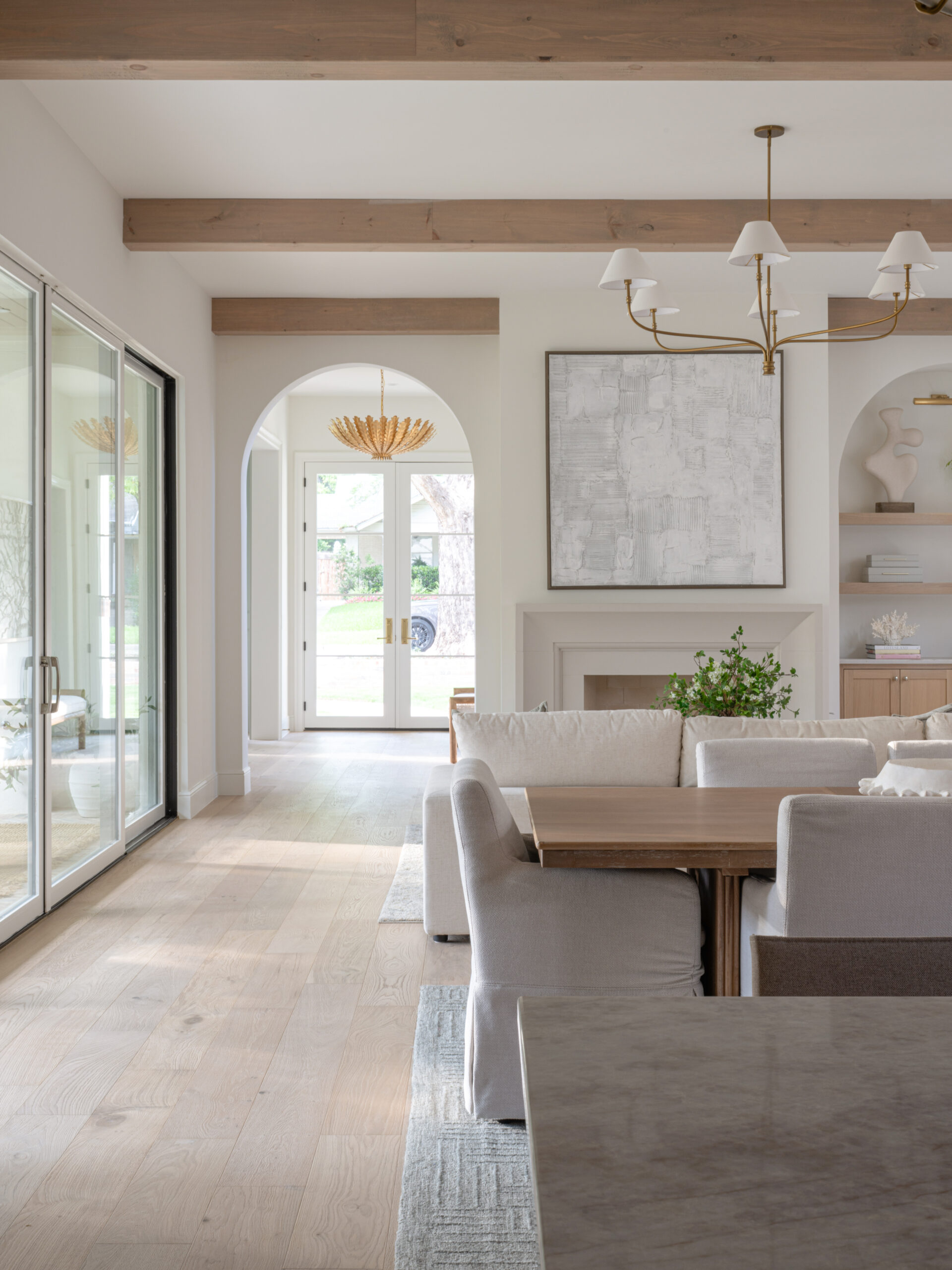CLASSIC EUROPEAN REVIVAL – Chamberlain Arlington Heights, Lafayette Ave, Fort Worth, TX 76107-24 Living room with wood beams and arched entry to the foyer — European style remodel, Fort Worth TX