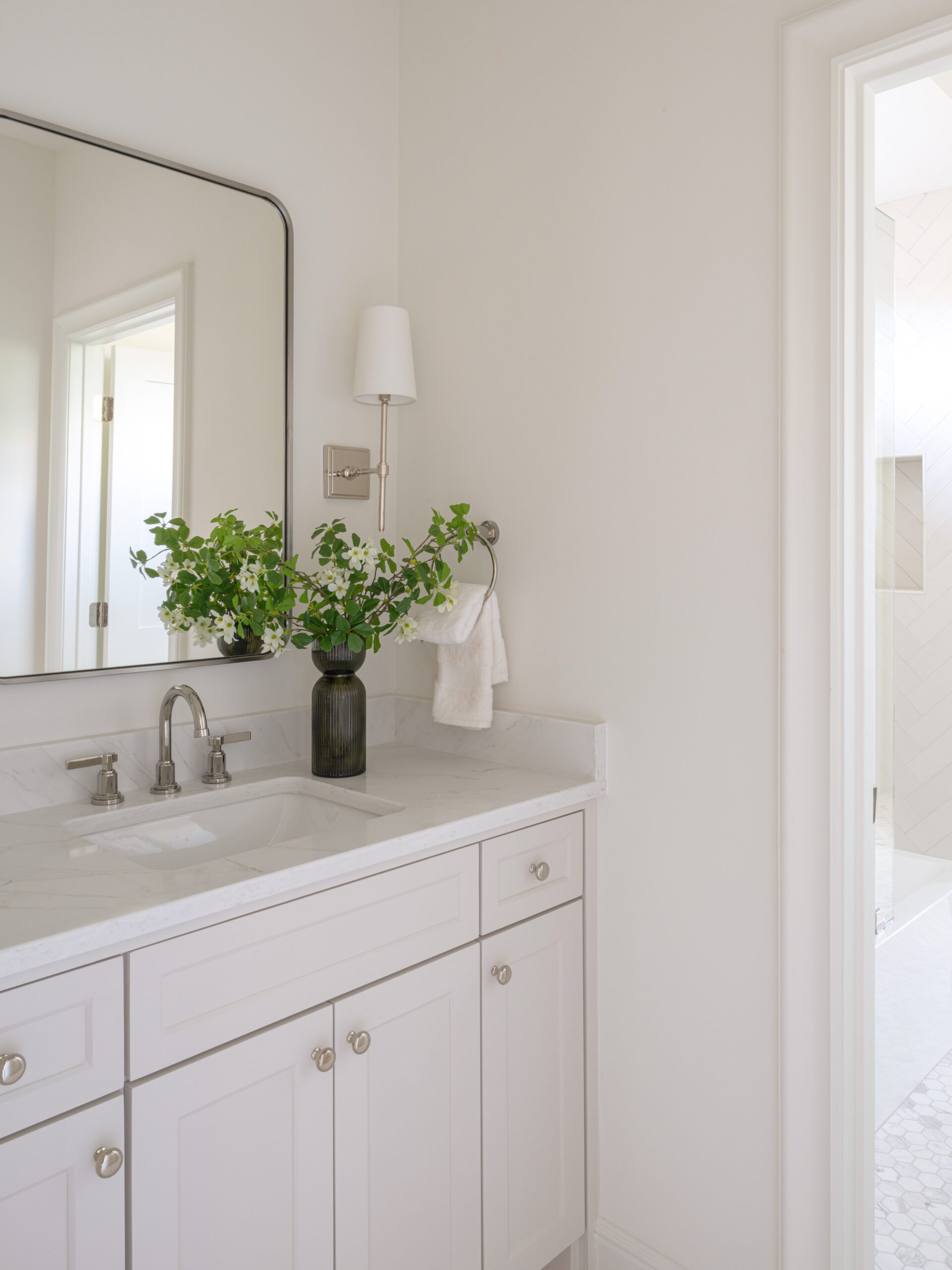 CLASSIC EUROPEAN REVIVAL – Chamberlain Arlington Heights, Lafayette Ave, Fort Worth, TX 76107-33 Bathroom vanity with nickel fixtures and herringbone tile shower beyond — custom remodel, Fort Worth TX