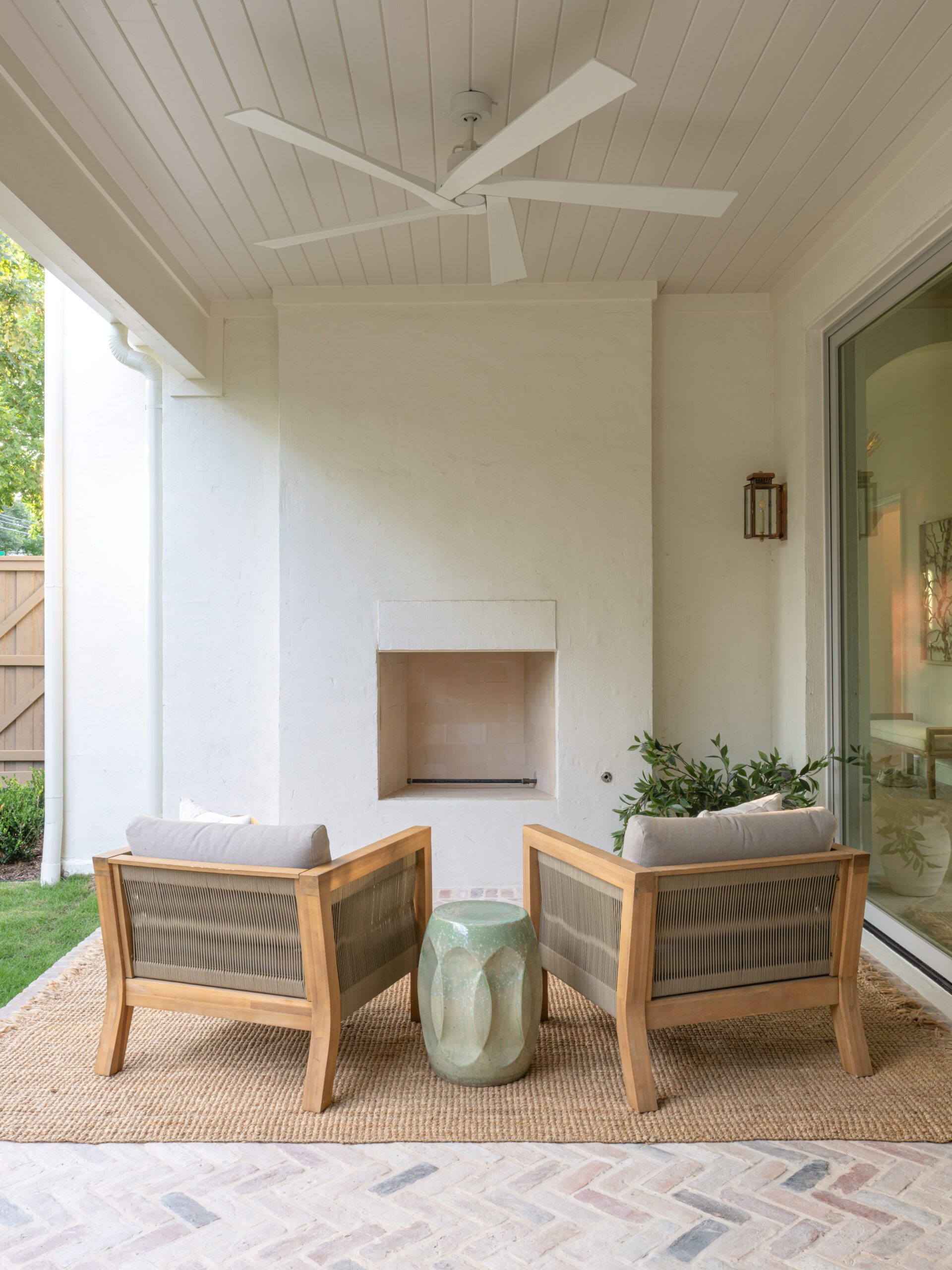 CLASSIC EUROPEAN REVIVAL – Chamberlain Arlington Heights, Lafayette Ave, Fort Worth, TX 76107-41 Covered patio with outdoor fireplace and herringbone brick floor — Blue Cypress Design Build, Fort Worth TX