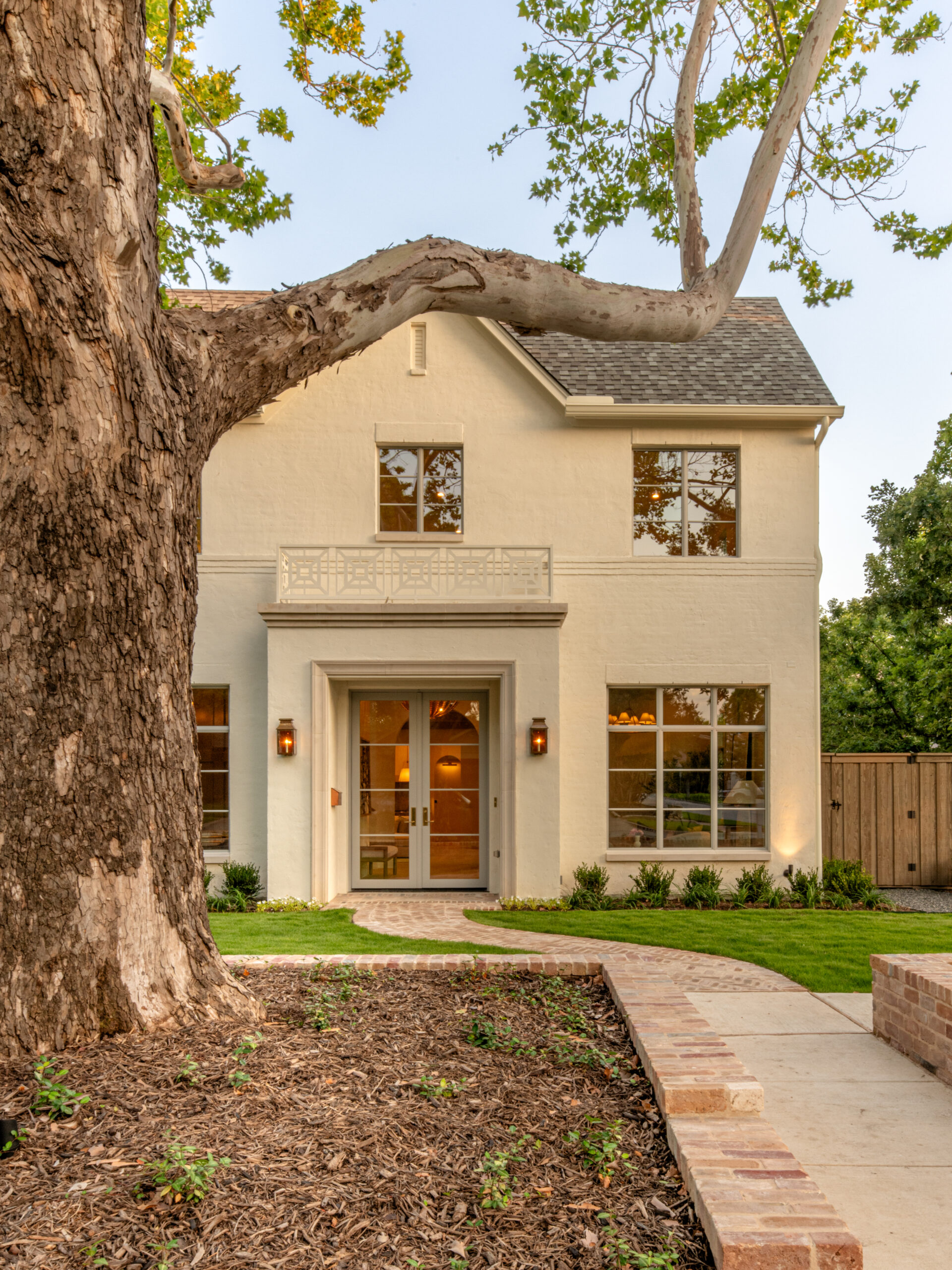 CLASSIC EUROPEAN REVIVAL – Chamberlain Arlington Heights, Lafayette Ave, Fort Worth, TX 76107-45 Front entry with lantern sconces and decorative balcony railing — luxury custom remodel, Fort Worth TX