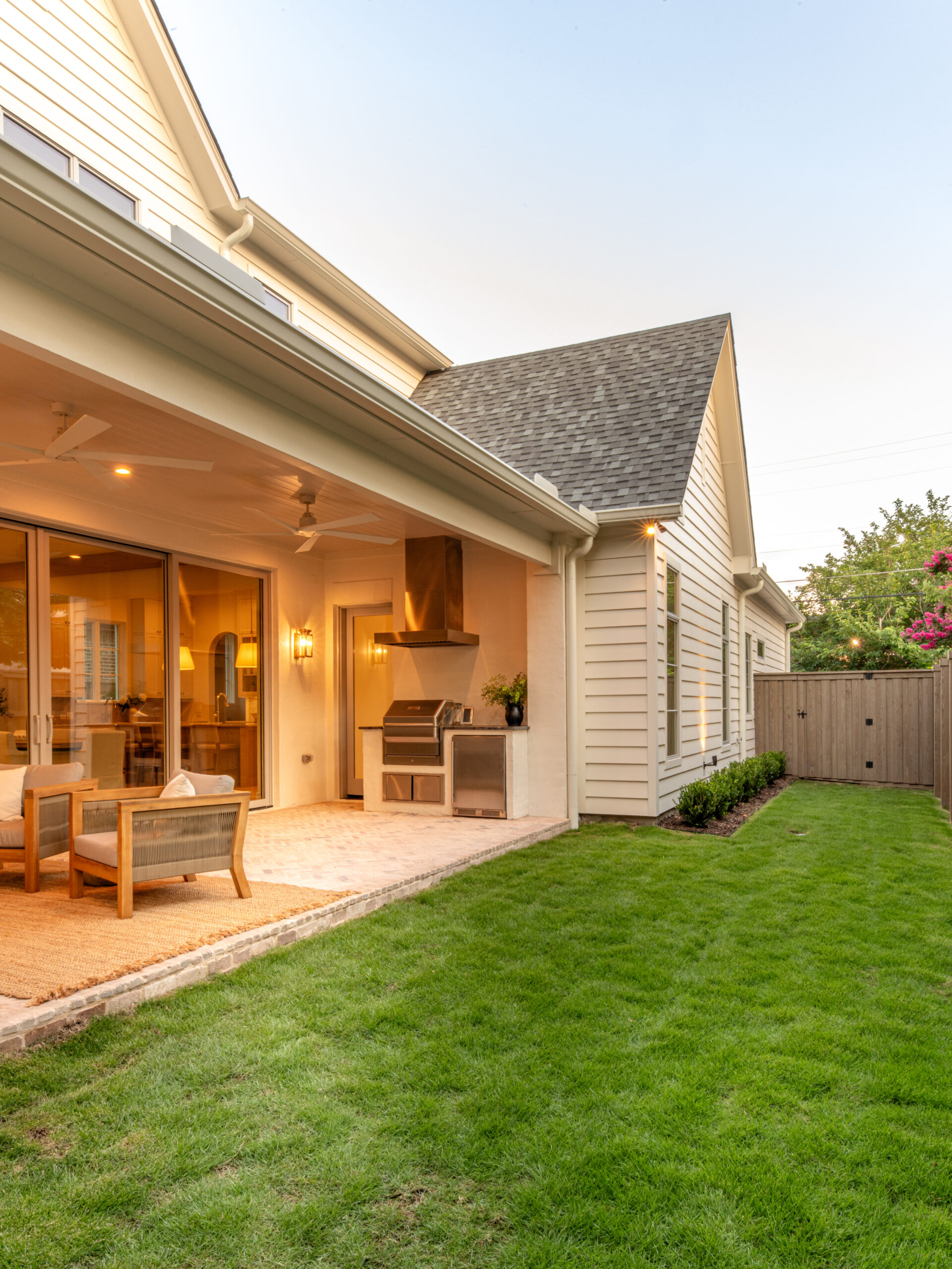 CLASSIC EUROPEAN REVIVAL – Chamberlain Arlington Heights, Lafayette Ave, Fort Worth, TX 76107-49 Backyard with covered patio, outdoor kitchen, and fresh landscaping — Blue Cypress Design Build, Fort Worth TX